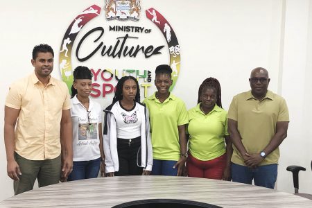 Dream realised! Minister of Culture, Youth and Sport Charles Ramson Jr (1st from left), and Director of Sport (1st from right) posing alongside national and scholarship awardees and national athletes, Adriel Austin (3rd from left) and Anisha Gibbons (3rd from right). Also in the photo is Linda Johnny, mother of Gibbons (2nd from right) and Austin’s mother Joylyn Beaton