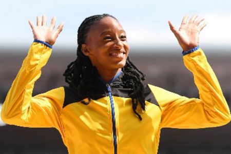 Barbadian Sada Williams celebrates on the podium after winning 400 metres gold 