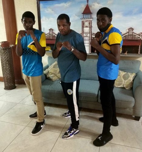 St Lucia head-coach Conrad Fredericks (centre) is flanked by boxers Herve Charlemagne (left) and Kevert Similien following their arrival on local shores
