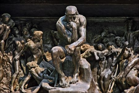 The Thinker in The Gates of Hell at the Musée Rodin (Photo by Jean-Pierre Dalbéra from Paris, France, CC BY 2.0, https://commons.wikimedia.org/w/index.php?curid=24671002)