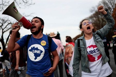 Pro-democracy demonstrators take part in a march in support of two manifestos defending the nation's democratic institutions and electronic voting system, in Brasilia, Brazil August 11, 2022. REUTERS/Ueslei Marcelino