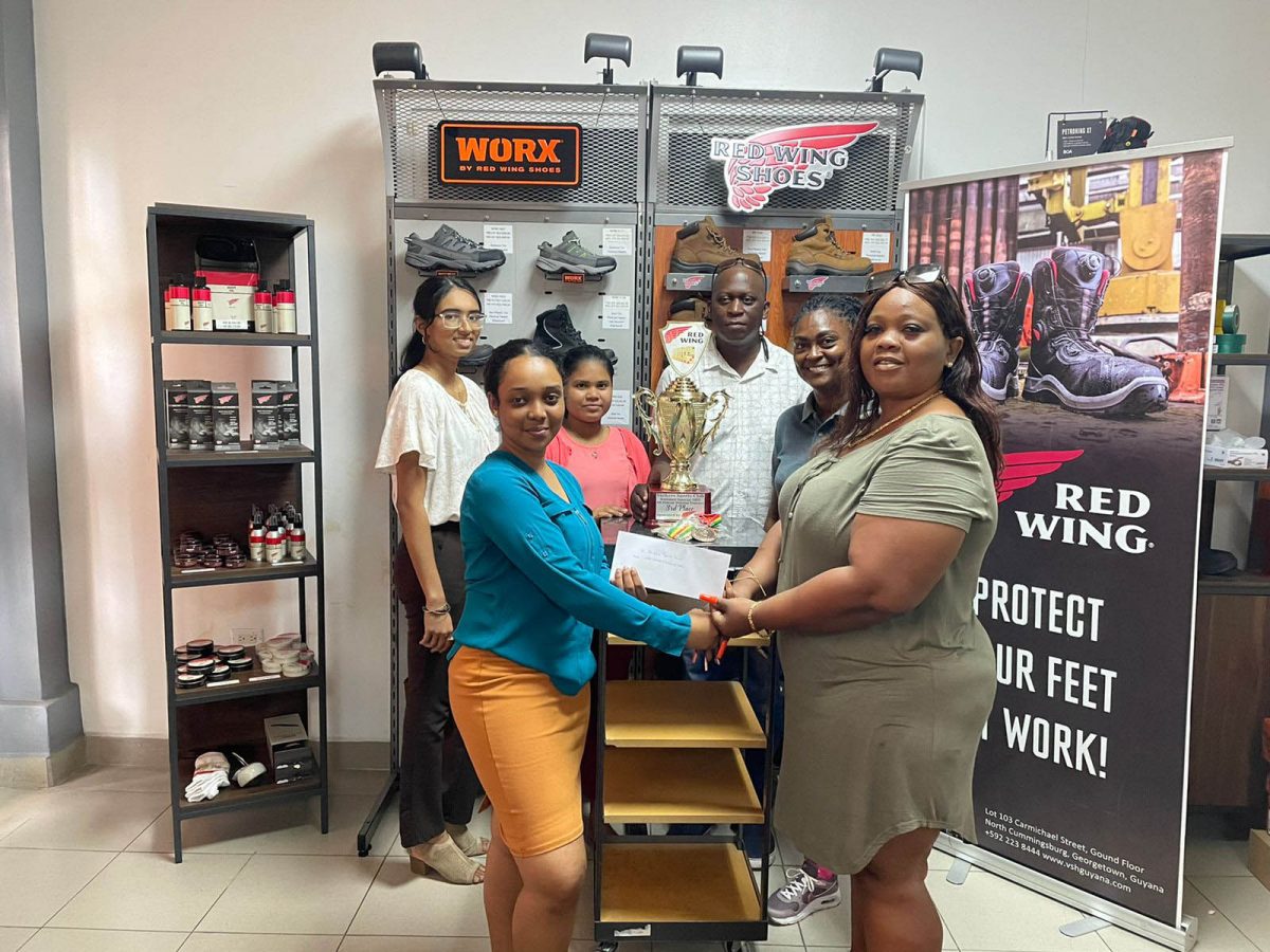 Charlyn Barnwell receives the third placed trophy with medals and sponsorship cheque from Sales Executive, Kerisha Beete while other sales executives, Houshadi Arjune, Lisa Ganesh, Customs Manager, Yoletta Bynoe, and Organiser Roderick Harry, savour the moment.