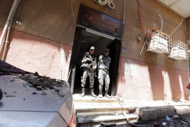 Security personnel outside the church after the fire (Reuters photo)