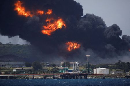 Fire is seen over fuel storage tanks that exploded near Cuba's supertanker port in Matanzas, Cuba, August 6, 2022. REUTERS/Alexandre Meneghini/File Photo