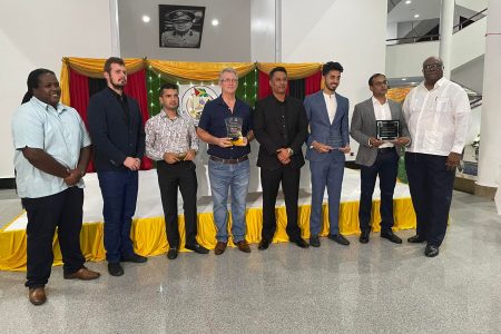 Some of the awardees along with the Ministry of Natural Resources’ Permanent Secretary Joslyn McKenzie (at left), GGMC Board Chairman Jimmy Reece (fourth, from right) and GGMC Commissioner Newell Dennison (at right) 