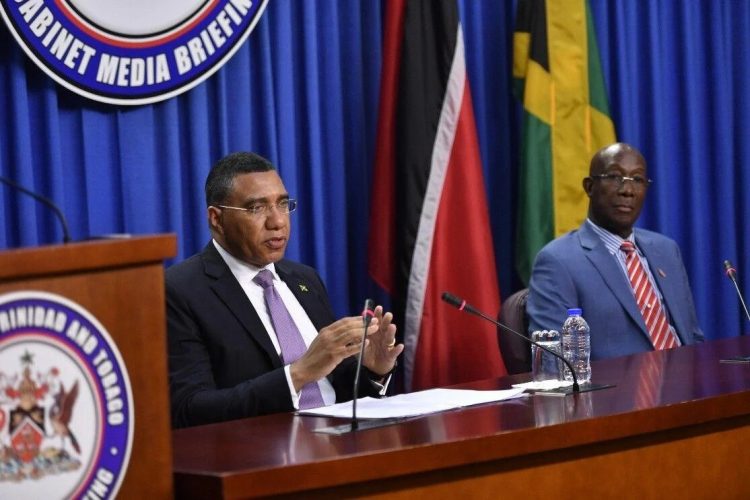 Jamaican Prime Minister Andrew Holness (left) responds to questions from members of the media during a joint news conference with Prime Minister Keith Rowley at the Diplomatic Centre yesterday. Prime Minister Holness is in Trinidad and Tobago for the 60th Independence anniversary celebrations.