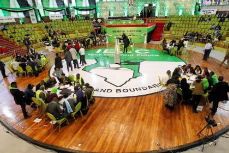 Various political parties delegates and officials from the Independent Electoral and Boundaries Commission (IEBC) meet at the IEBC National Tallying centre at the Bomas of Kenya, in Nairobi, Kenya August 11, 2022. REUTERS/Monicah Mwangi