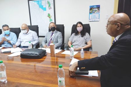 Minister of Public Works, Juan Edghill (right) presiding over the meeting
