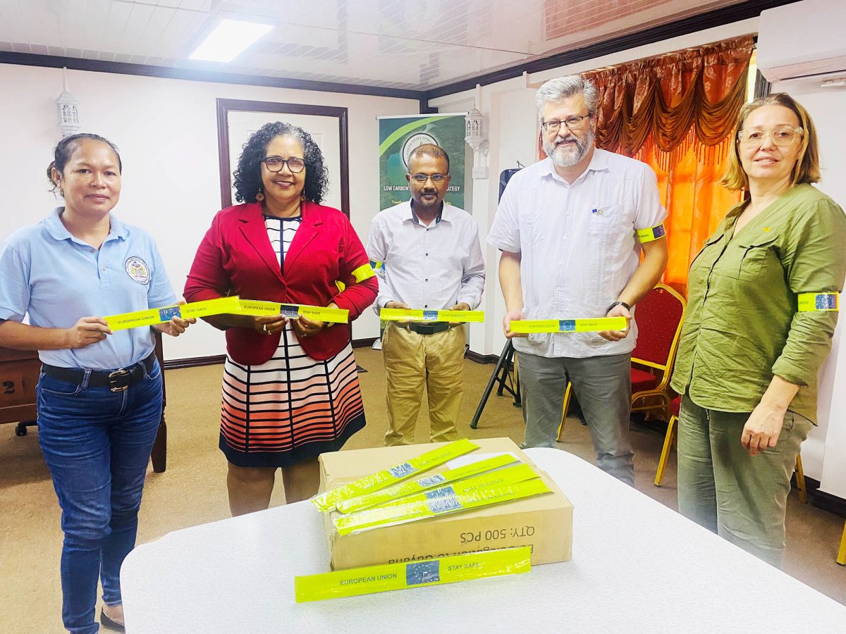  Left to right are Acting Regional Executive Officer, Yvette Hastings; Regional Chairperson, Vilma Da Silva; Regional Vice Chairman, Humace Oodit; Head of Delegation of the European Union to Guyana, Dr Fernando Ponz Cantó; and Deputy  Head of, Evelina Melbarzde, posing with the safety bands.
