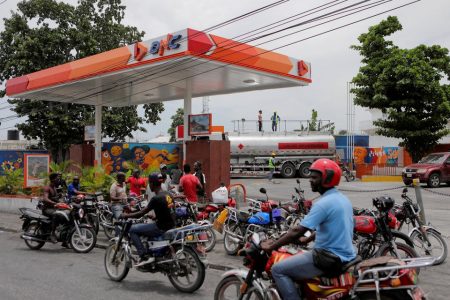 People wait outside a petrol station as Haiti's main fuel terminal renewed deliveries that had been suspended due to an outbreak of gang violence, in Port-au-Prince, Haiti July 14, 2022. REUTERS/Ralph Tedy Erol