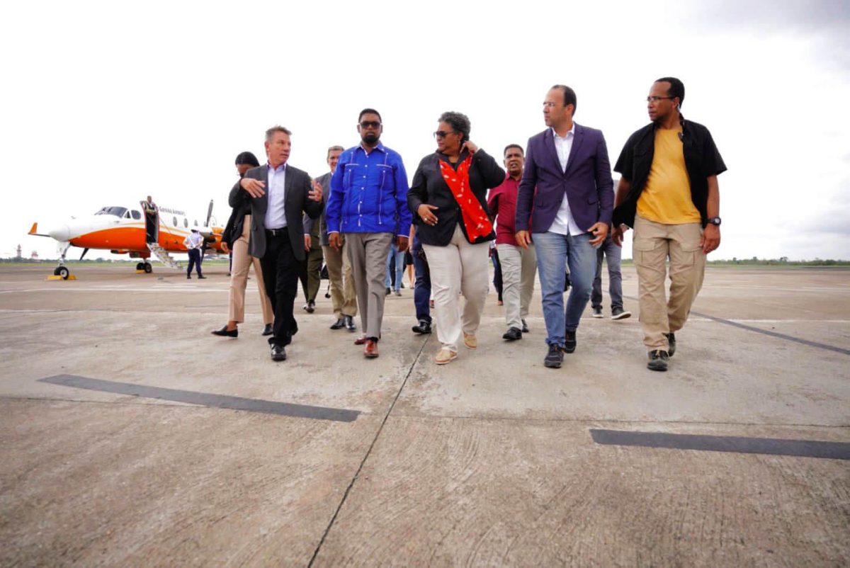 President Irfaan Ali (second from left in front row) and Barbadian Prime Minister Mia Mottley (third from left in front row) after their arrival yesterday in the Brazilian state of Roraima.  The Governor of Roraima, Antonio Denarium is at left in front row. (Office of the President photo)