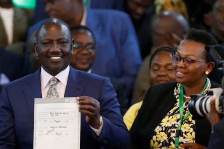 William Ruto holding the proclamation