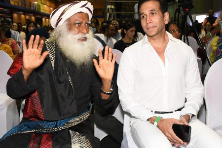 Sadhguru speaks with Local Government Minister Faris Al-Rawi at An Evening with Sadhguru at the Centre of Excellence, Macoya, on Wednesday.