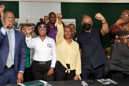 Members of JTUM show a fist of support following the announcement of a massive march on Friday, at a press conference at the PSA Headquarters, Abercromby Street, Port-of-Spain yesterday. From left, president of the PSA Leroy Baptiste, Second President of the RMN, Letitia Cox, President of Contractors and General Workers Trade Union, Nicole Olivierre, President of the OWTU, Ancel Roget and President of the Seamen and Waterfront Workers Trade Union, Michael Annisette.
