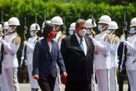 Taiwan President Tsai Ing-wen and Saint Vincent and the Grenadines Prime Minister Ralph Gonsalves review the honour guard during a welcome ceremony outside the presidential palace in Taipei, Taiwan August 8, 2022. REUTERS/Ann Wang