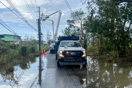 Workers with Luma Energy try to restore power on a flooded street in Cabo Rojo, Puerto Rico, on Saturday.Daniella Silva / NBC News