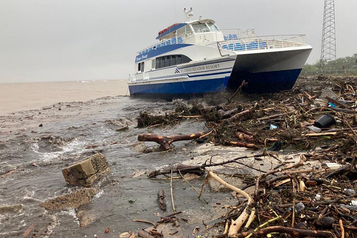A boat lies washed up on shore after the passing of Hurricane Fiona in Ponce, Puerto Rico September 19, 2022.  REUTERS/Ricardo Ortiz