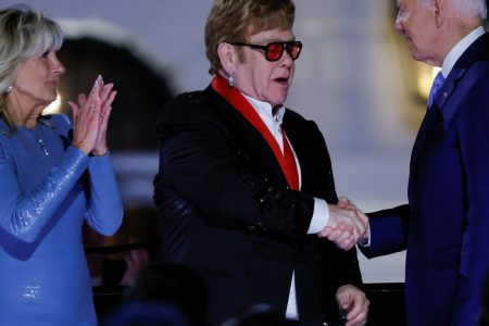 U.S. first lady Jill Biden claps as British rocker Elton John is awarded the National Humanities Medal by U.S. President Joe Biden at the White House in Washington (Reuters Photo)