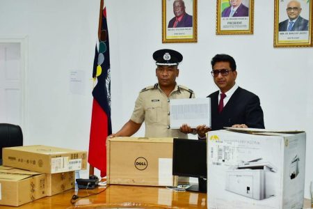 Attorney General, Anil Nandlall (right) handed over the equipment to Deputy Commissioner ‘Administration’ (ag) Calvin Brutus on Monday. (Photo taken from the AG’s Facebook page)