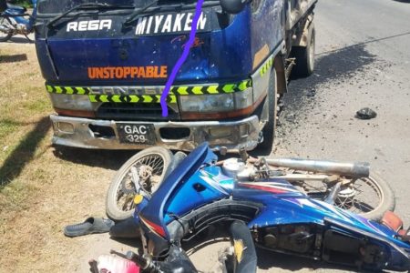The truck and Imran Haniff’s motorcycle after collision that claimed his life 