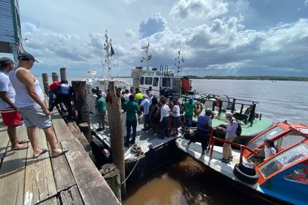 Persons disembarking at the GRA Customs Boathouse at the Georgetown Stelling