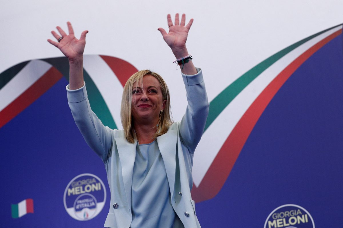 Leader of Brothers of Italy Giorgia Meloni waves at the party's election night headquarters, in Rome, Italy September 26, 2022. REUTERS/Guglielmo Mangiapane