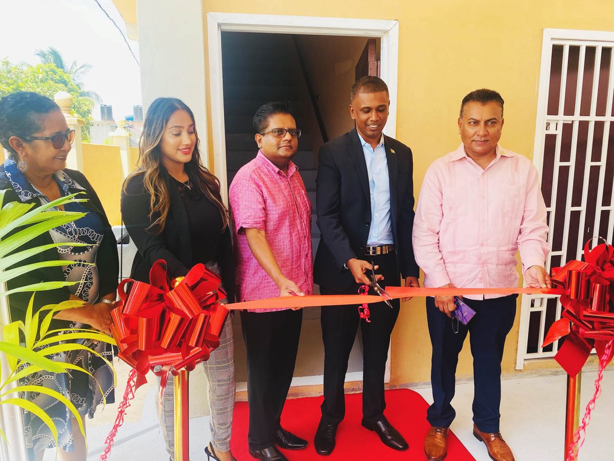 Chief Executive Officer (CEO) Ken Deocharran cuts the ribbon for the opening of the Express International Inc’s Henrietta branch
