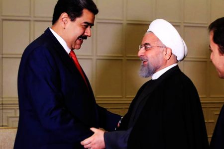 Nicolas Maduro shakes hands with Iran's president Hassan Rouhani before a bilateral meeting in Baku in October 2019