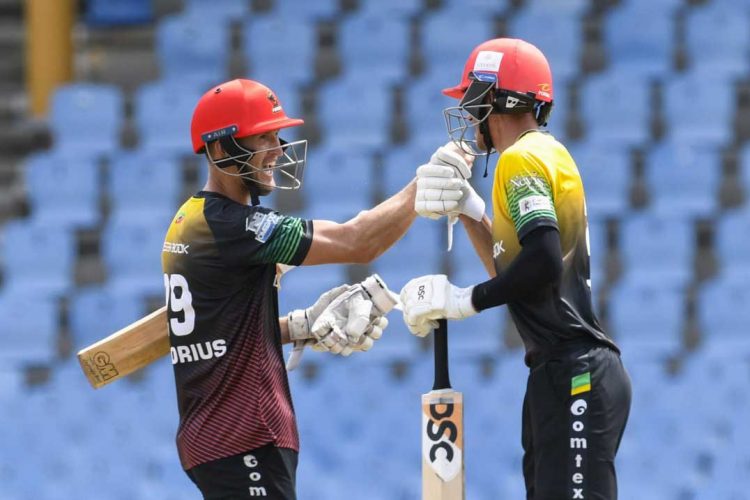 Dwaine Pretorius and Duan Jansen of the St. Kitts and Nevis Patriots celebrate victory against the Guyana Amazon Warriors