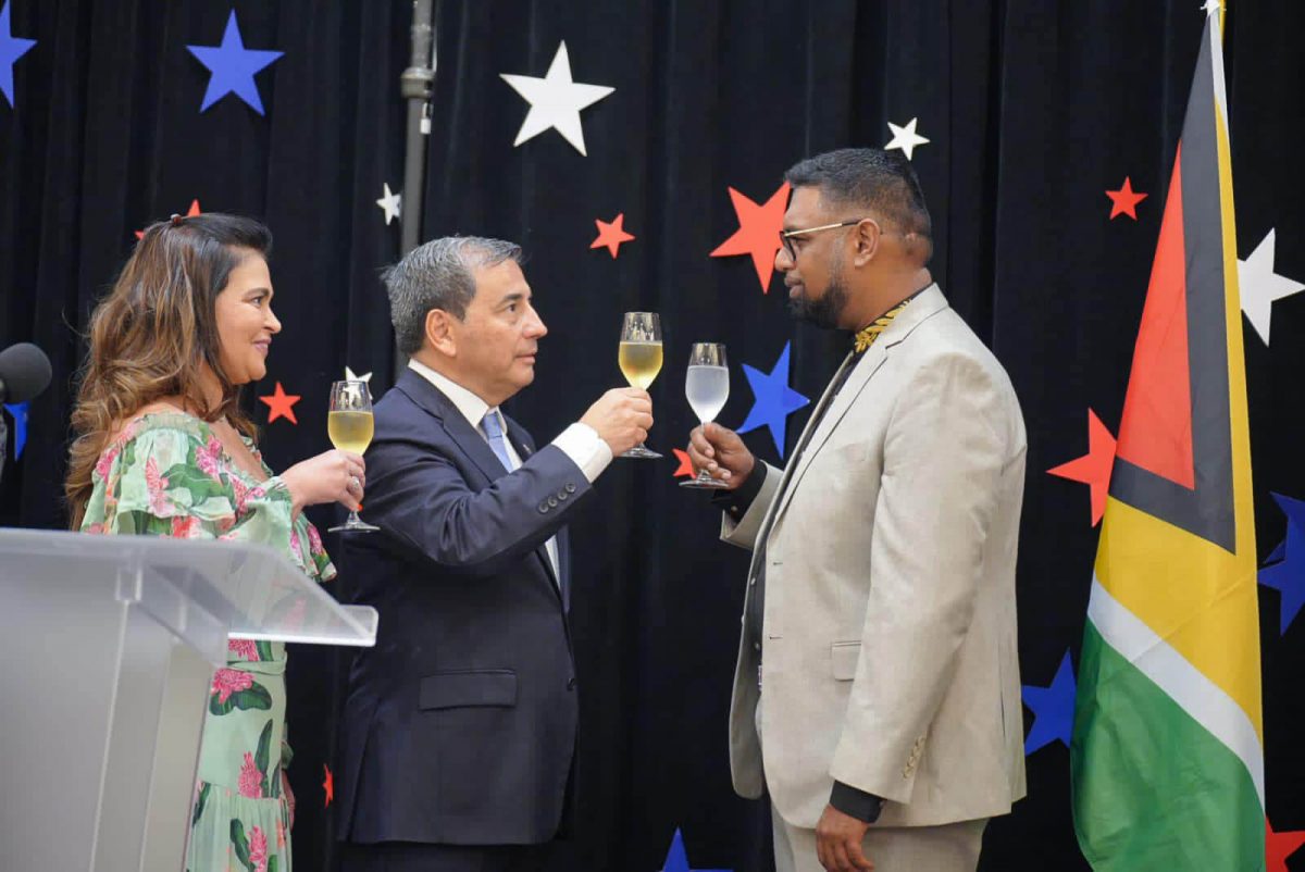 President Irfaan Ali (R) and Ambassador of the Republic of Chile Juan Manuel Pino Vásquez share a toast at a celebration held on Tuesday evening at the Marriott Hotel in Georgetown to mark Chile’s 212th Independence anniversary (Office of the President photo)
