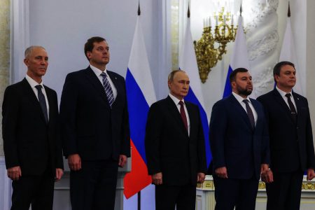 Russian President Vladimir Putin and Denis Pushilin, Leonid Pasechnik, Vladimir Saldo, Yevgeny Balitsky, who are the Russian-installed leaders in Ukraine’s Donetsk, Luhansk, Kherson and Zaporizhzhia regions, attend a ceremony to declare the annexation of the Russian-controlled territories in the Georgievsky Hall of the Great Kremlin Palace in Moscow, Russia, September 30, 2022. (Photo: Sputnik/Mikhail Metzel/Pool via REUTERS)
