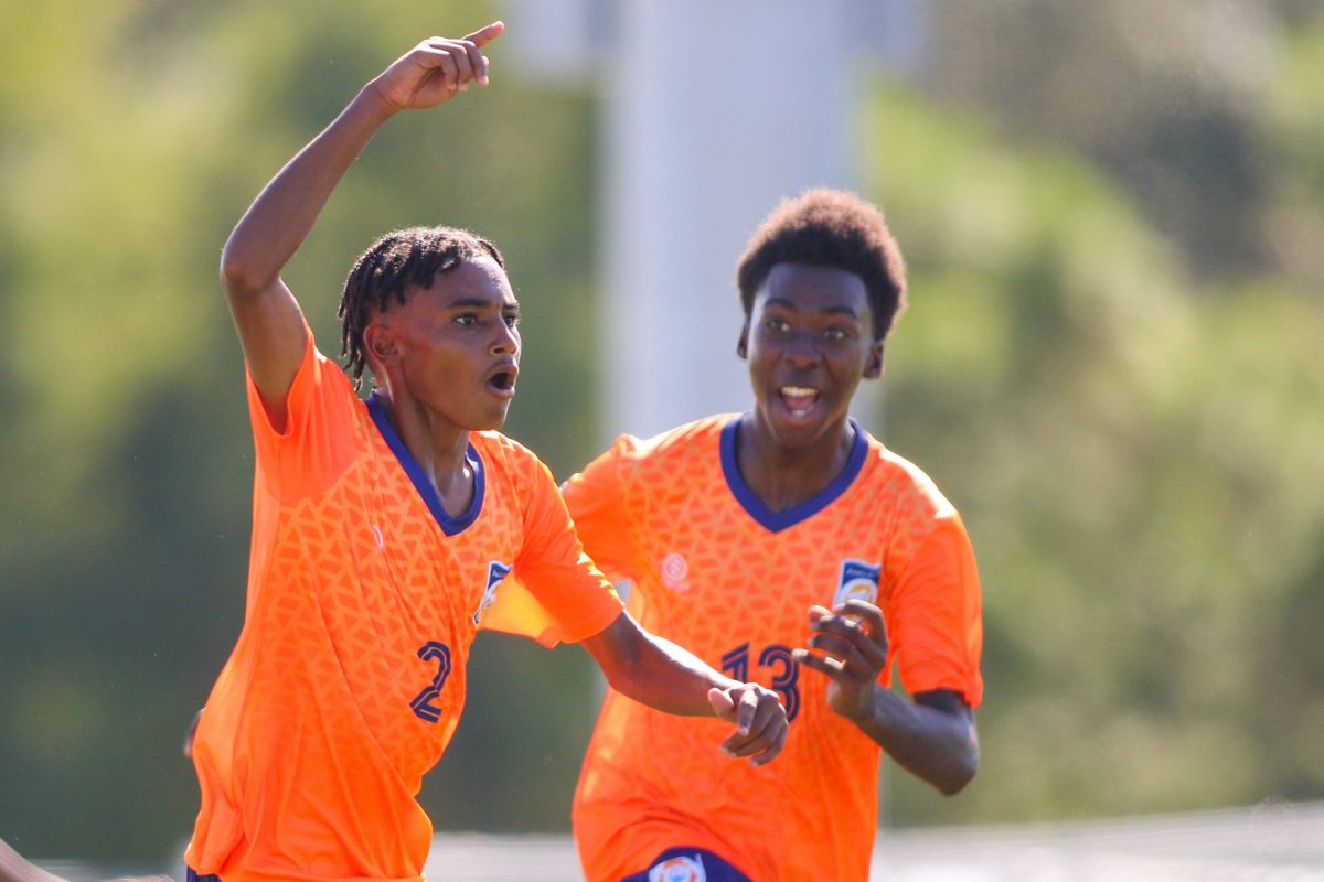 Anguilla’s Jared Simeins (left) and teammate Rochard Grant celebrate after the former scored against the US Virgin Islands. (Photo: CONCACAF)