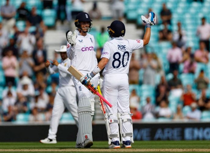  England’s Ollie Pope and Zak Crawley celebrate winning the match and series Action Images via Reuters/Andrew Boyers