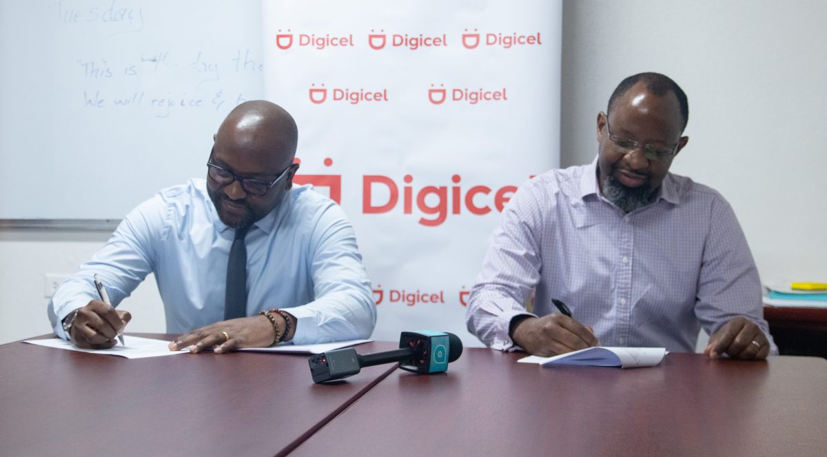 Permanent Secretary of the Ministry of Health Malcolm Watkins and Digicel Guyana Chief Executive Officer Gregory Dean signing the agreement (Digicel Guyana photo) 