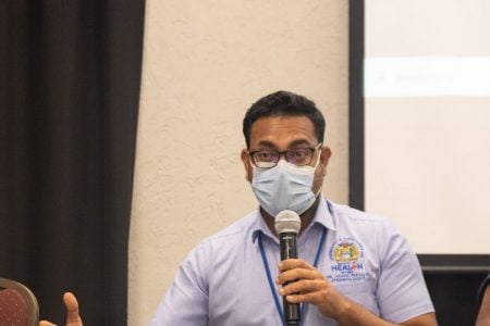 Dr Anand Persaud speaking yesterday at the event (Ministry of Health photo)