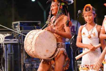 This resplendently dressed senior drummed in  his message at the Amerindian Heritage Cultural Extravaganza  on Thursday. (Office of the President photo)
