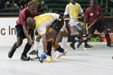 Scenes from the Saints Splinters and Old Fort (red) clash in the Lucozade Indoor Hockey Championship Thursday night.

