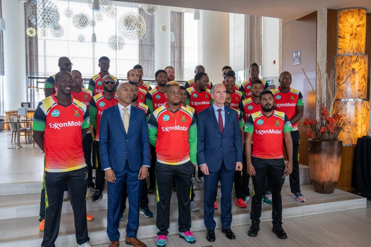 ExxonMobil Guyana President, Alistair Routledge (second from right) and members of the Guyana Amazon Warriors