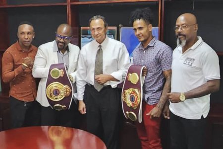 Australian based Gairy St. Clair is currently in Guyana making the rounds and pulling out the stops in order
to stage a mega year-end Pro/Am card. He got the green light from the boxing board headed by
Peter Abdool (centre) yesterday to host the event on December 16.
