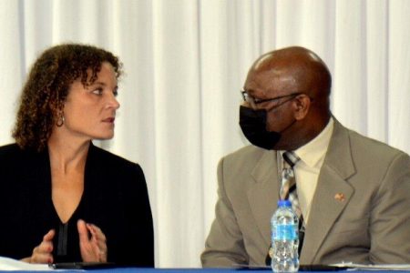 At the launch: Megan Kelly, US Embassy Deputy Chief of Missions (left), speaks to acting Police Commissioner McDonald Jacob during yesterday’s launch of the Gang Reduction and Community Empowerment project (Project Grace) at the Police Academy on Samaan Drive, St James. —Photo: ROBERT TAYLOR