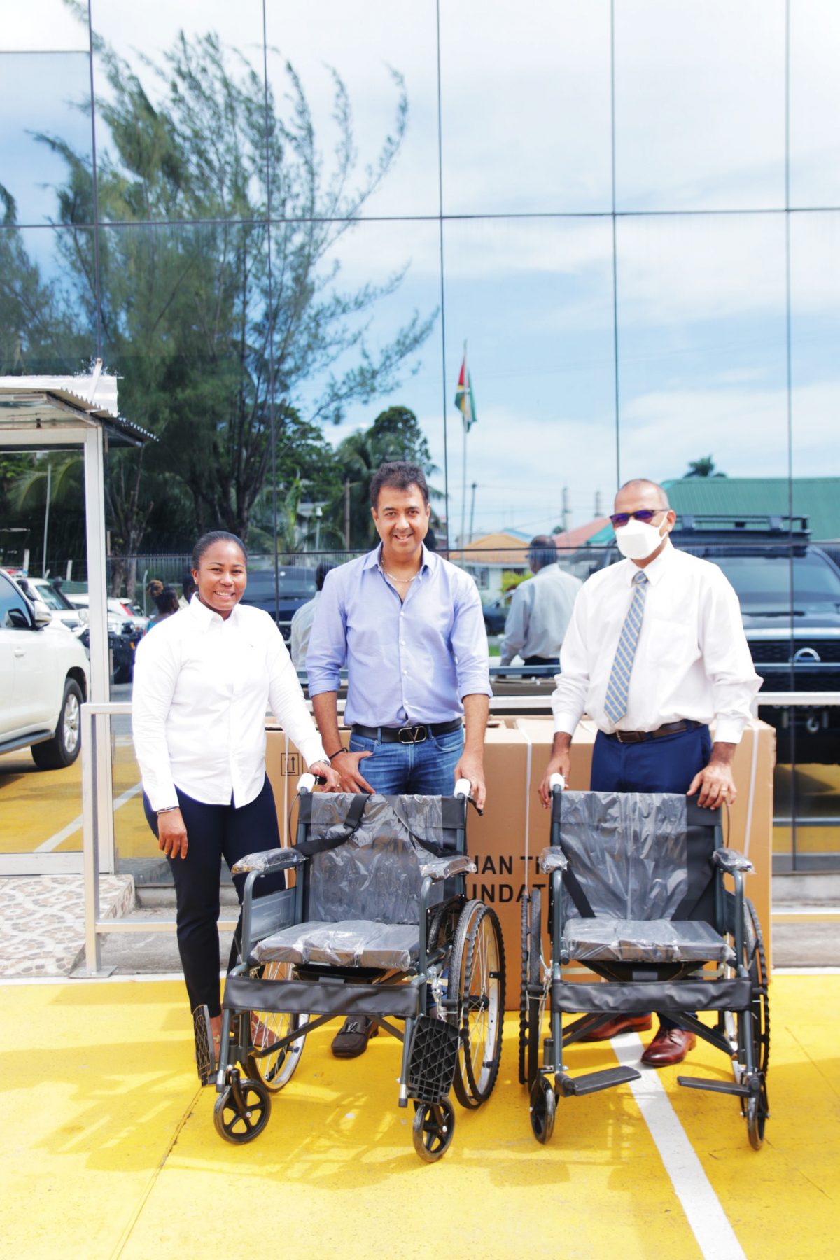 Minister of Health, Frank Anthony (at right) with the wheelchairs. At centre is Gautam Thani with Dr Ariane Mangar (Ministry of Health photo)
