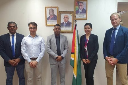 Minister in the Ministry of Public Works, Deodat Indar (centre) and Ramesh Ghir (left) with the team. (Ministry of Public Works photo)
