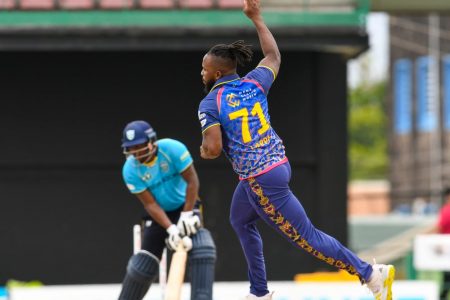 Kyle Mayers peels away in celebration after bowling Johnson Charles. (Photo courtesy Getty/CPL) 