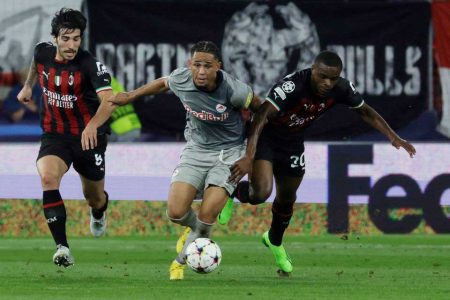 Noah Okafor in action with AC Milan’s Pierre Kalulu and Sandro Tonali REUTERS/Leonhard Foeger