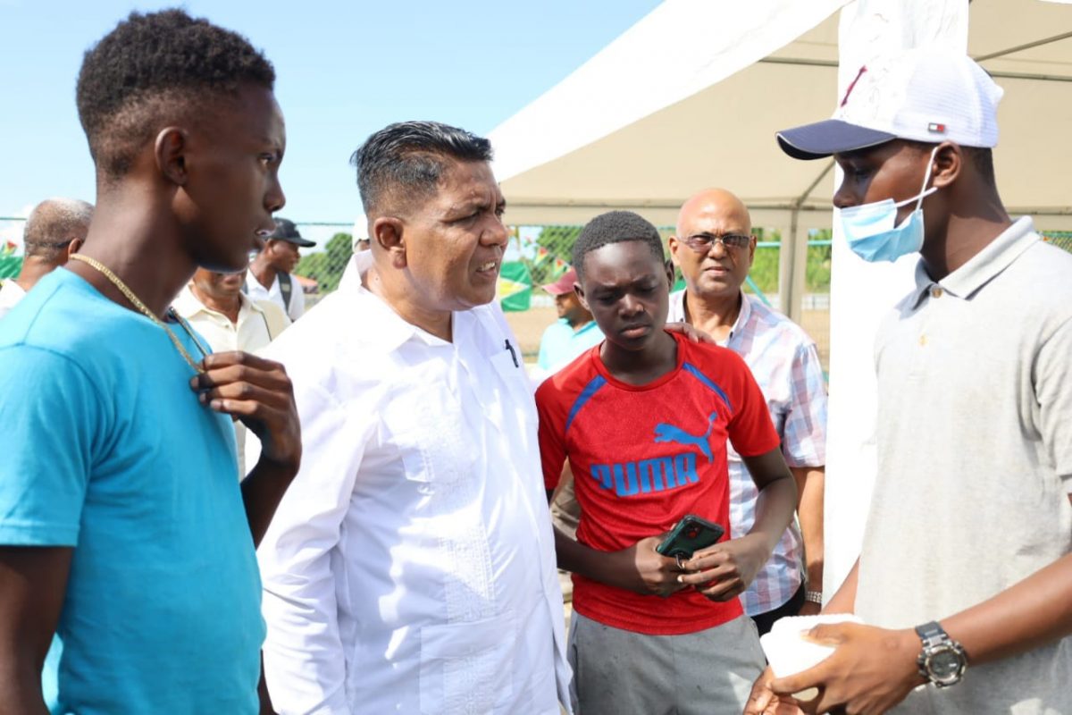 Agriculture Minister Zulfikar Mustapha interacts with youths from the village (DPI Photo)