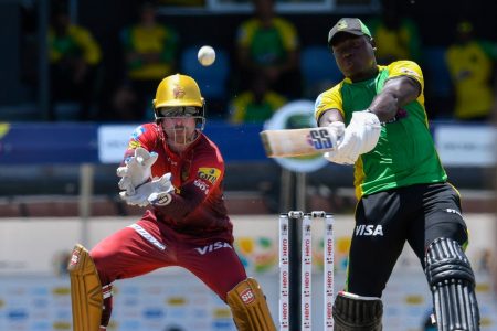  Rovman Powell hits out during his half-century against TKR yesterday. (Photo courtesy Getty/CPL) 