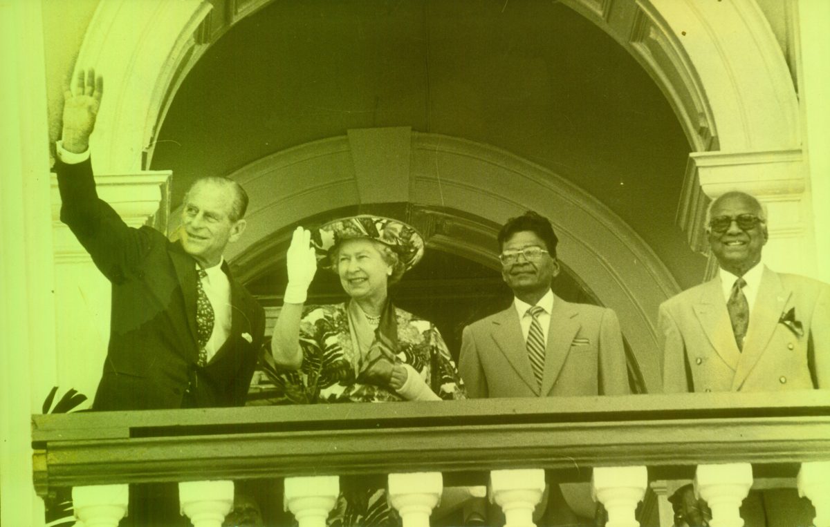 The royal couple waving from the balcony of Parliament. President Cheddi Jagan is at right. Second from right was then Speaker of the National Assembly, the late Derek Jagan.