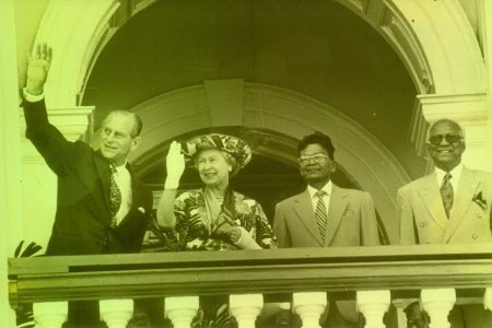The royal couple waving from the balcony of Parliament. President Cheddi Jagan is at right. Second from right was then Speaker of the National Assembly, the late Derek Jagan.