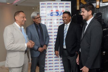 Vasant Bharath vice chairman of SCA, left, Curtis Mohammed executive director, founder of SCA Vernon Persad and CSA’s chairman Rajiv Diptee during a meeting of the Caribbean Supermarket Association at Krave Restaurant in Marabella.
