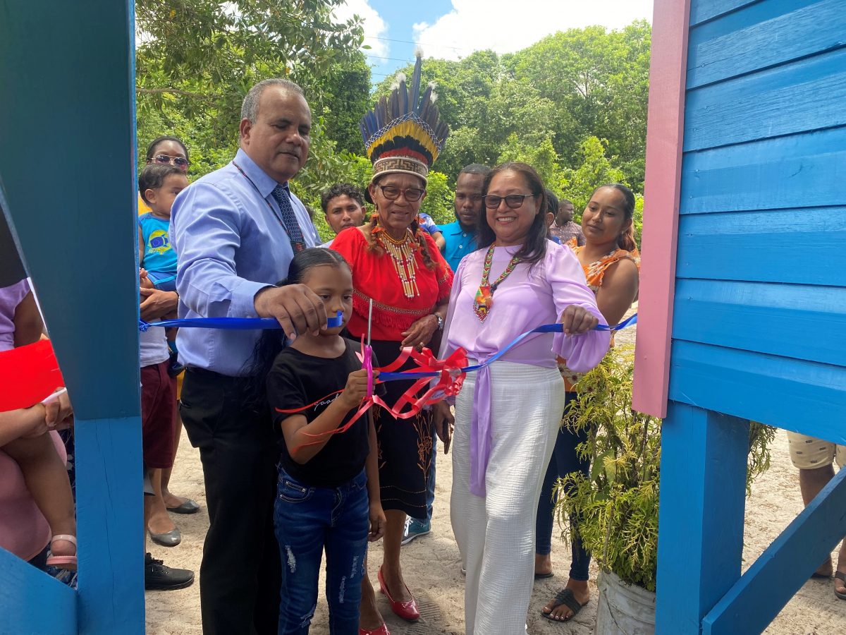 The ribbon cutting. Kent Vincent is at left and Minister of Amerindian Affairs Pauline Sukhai is at right.